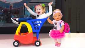 Stacy is having fun shopping with the baby doll